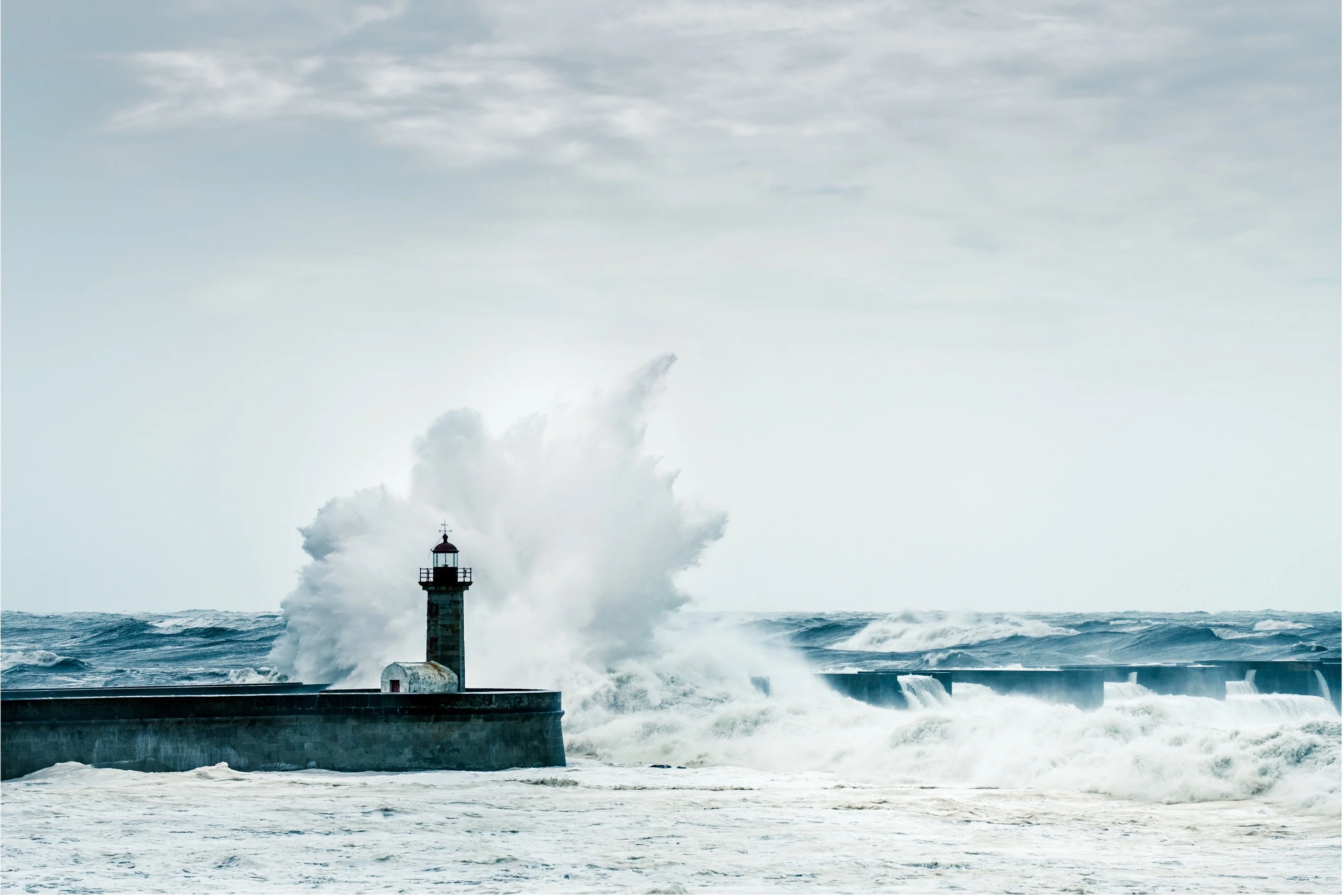 Lighthouse overlooking the coast — representing navigational guidance in infrastructure investment